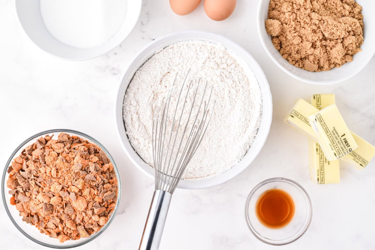 whisking flour, baking soda and baking powder in a bowl