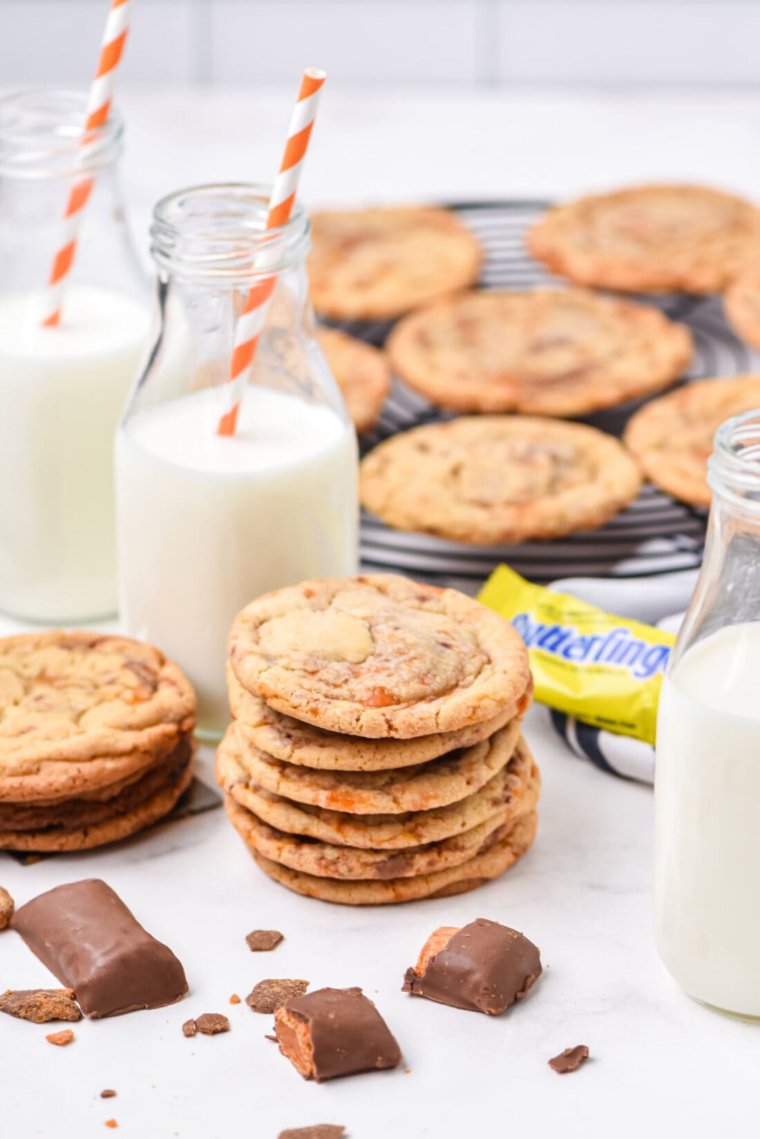 stack of Butterfinger Cookies with milk