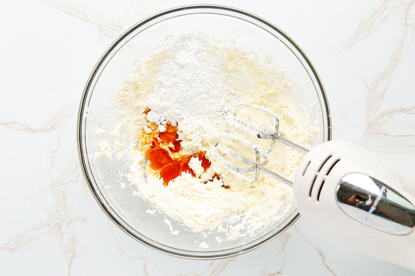 powdered sugar, heavy cream, and vanilla added to cream cheese mixture