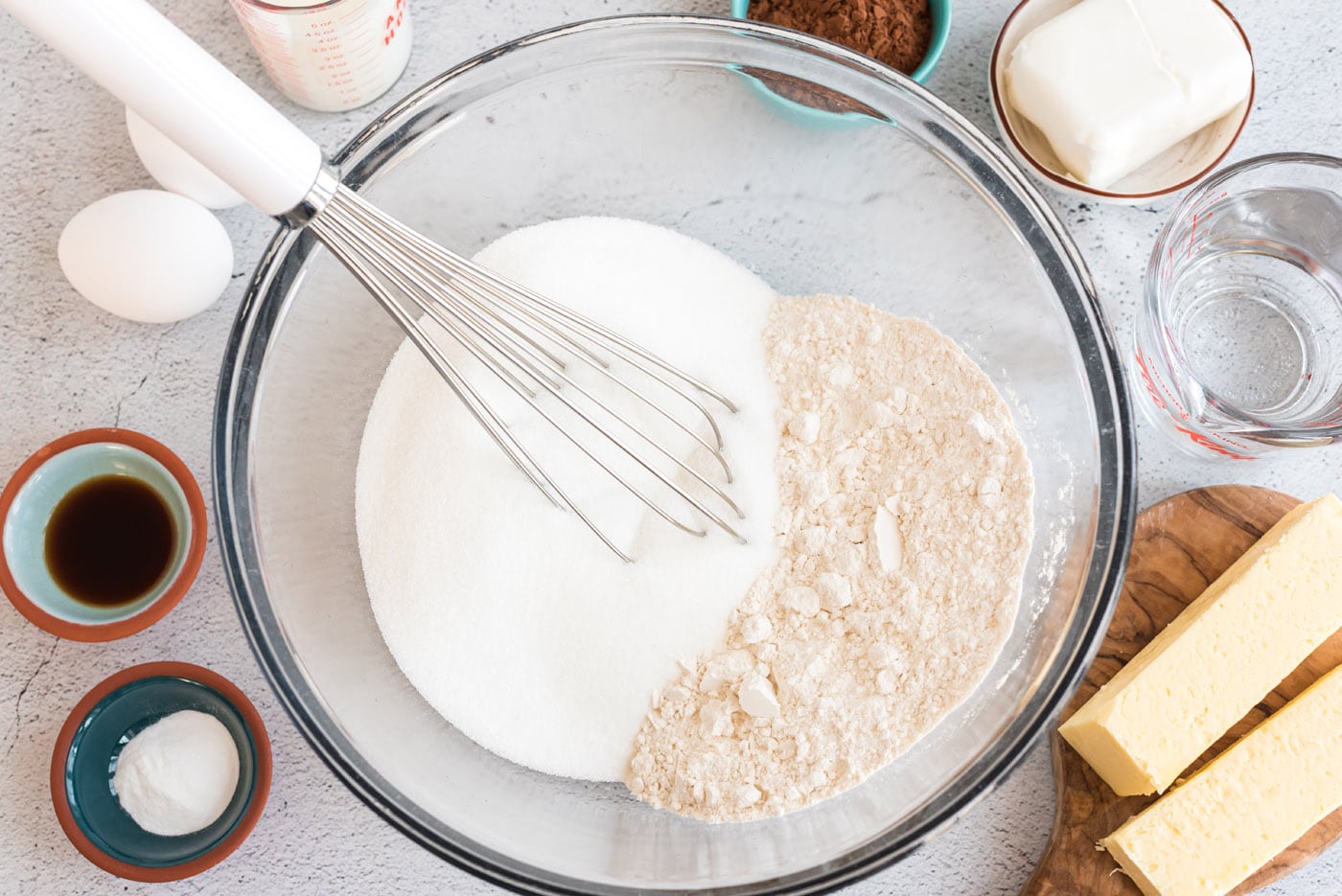 flour and sugar in a bowl with a whisk