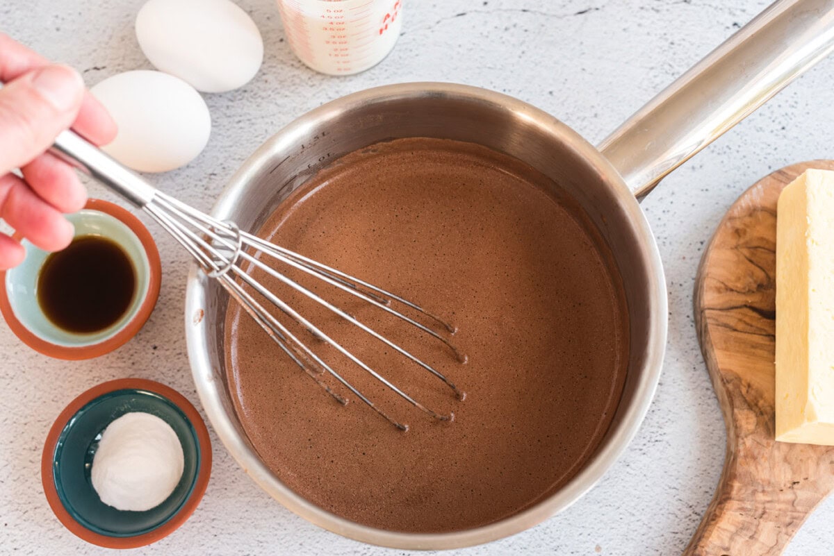 whisking chocolate texas sheet cake batter