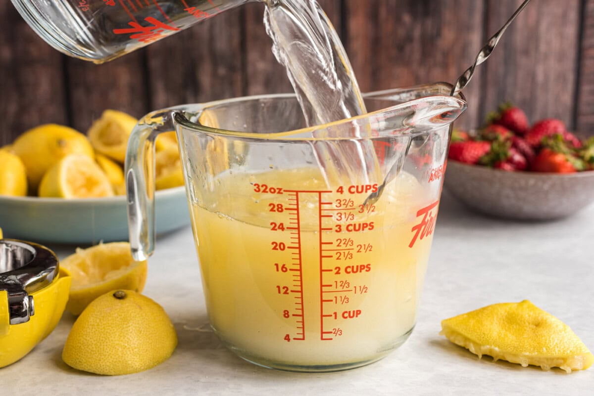 pouring boiling water into lemon juice