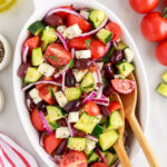 Greek Salad with wooden spoons