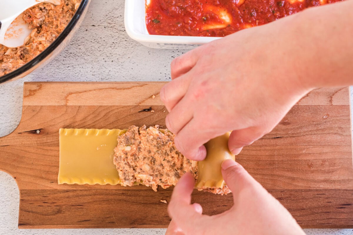 rolling lasagna noodle with filling
