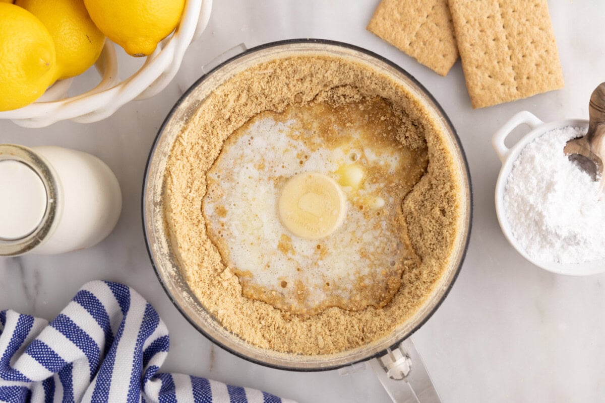 graham cracker crumbs and melted butter in a food processor