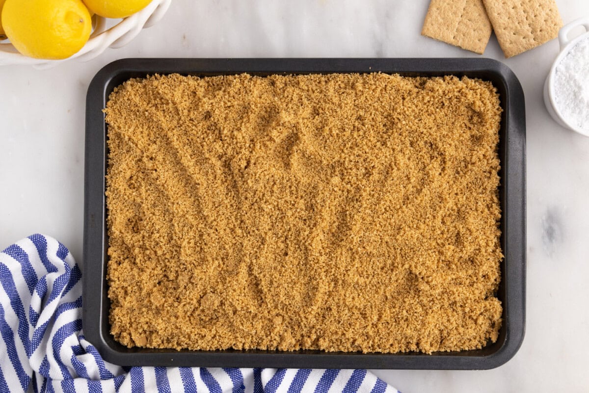 graham cracker crumbs on a baking sheet