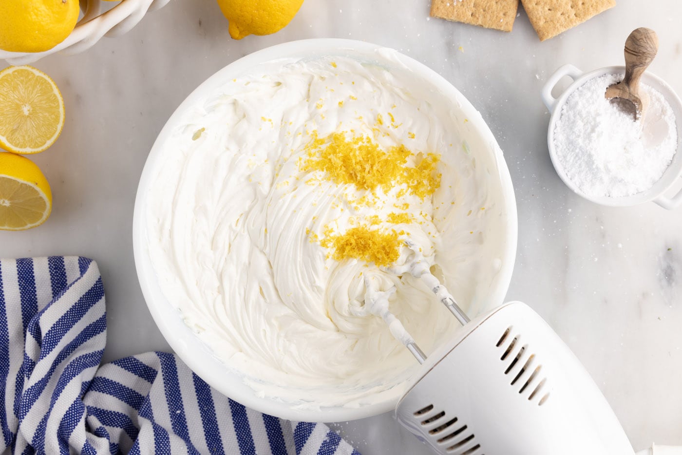 mixing in lemon zest to cream cheese
