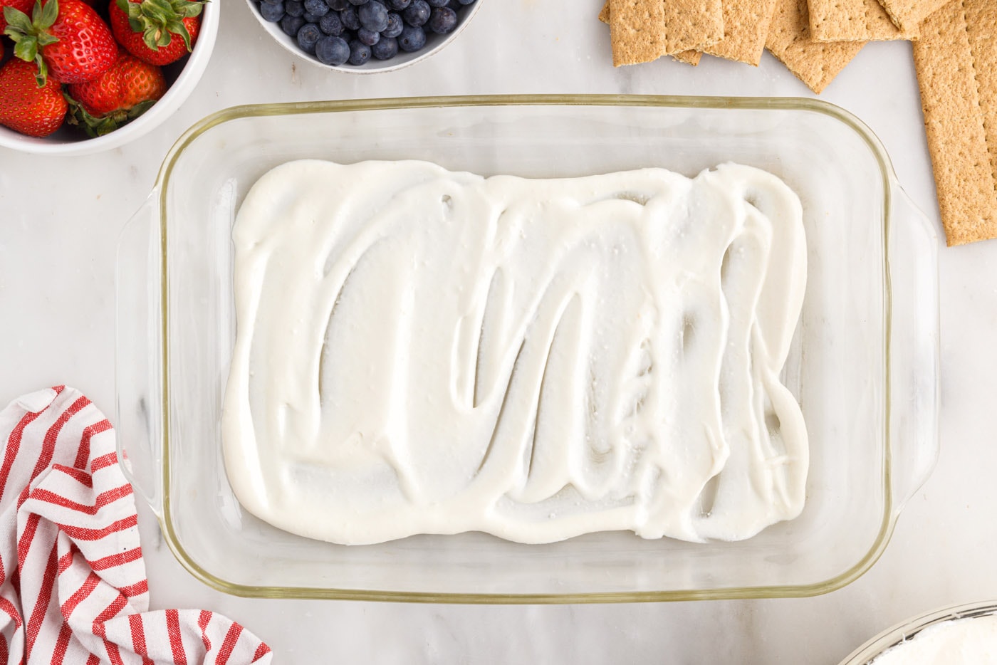 cool whip pudding mixture on bottom of 13x9 dish