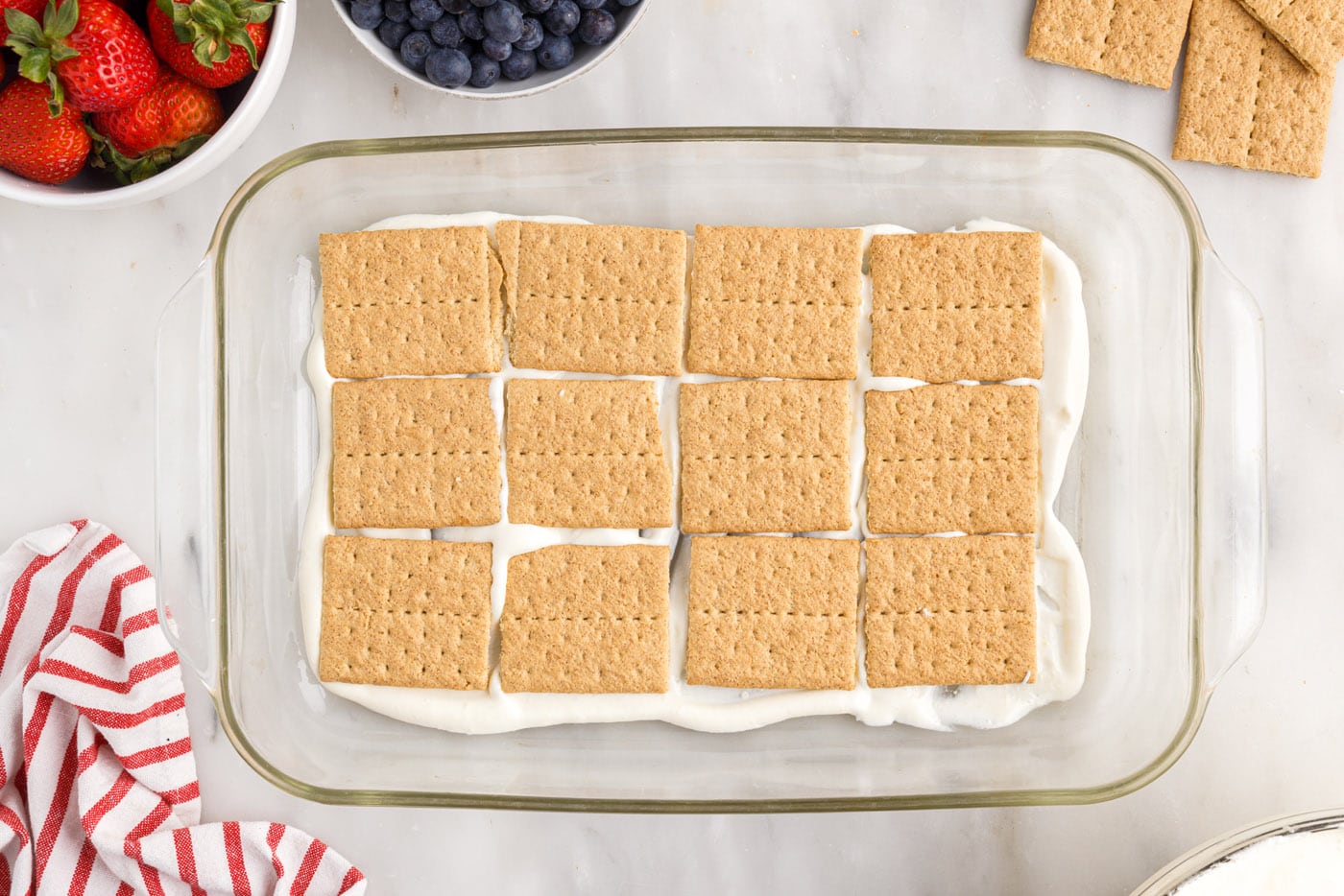 graham crackers layered on top of cool whip pudding mixture