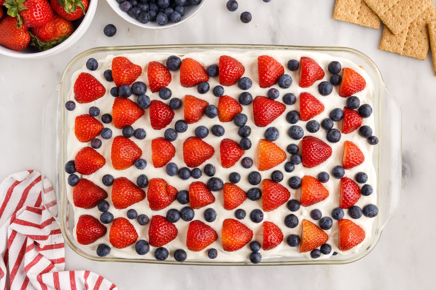 Strawberries and blueberries on top of the mixed berry icebox cake
