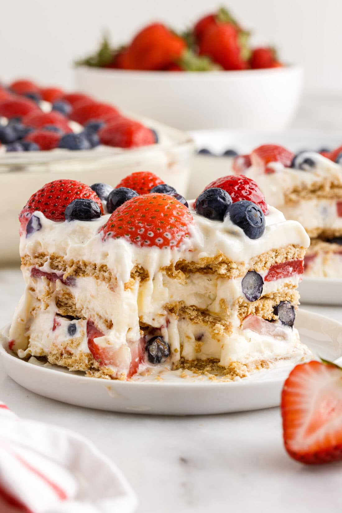 slice of Mixed Berry Icebox Cake with a bite out of it