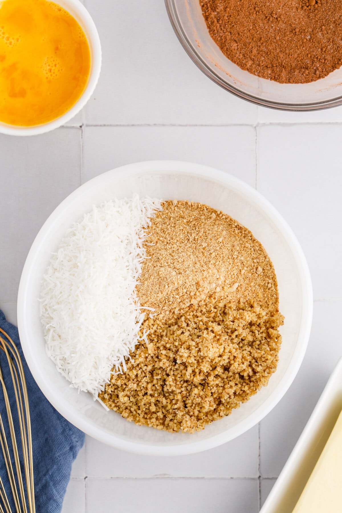 coconut, graham, and walnuts in a bowl