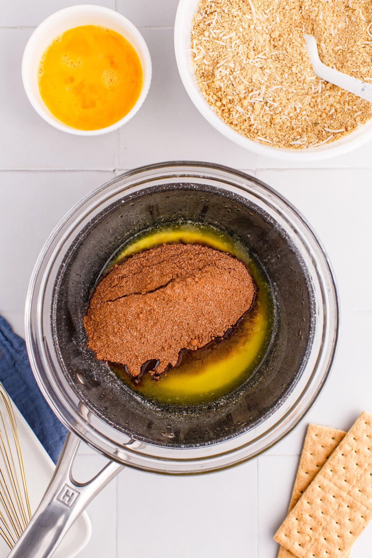 melted butter with cocoa powder and sugar on the stovetop
