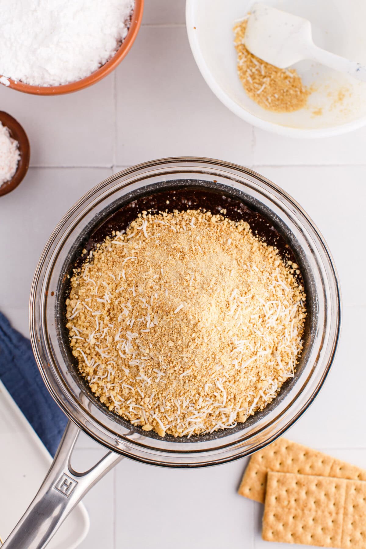 crumb and coconut mixture added to bowl