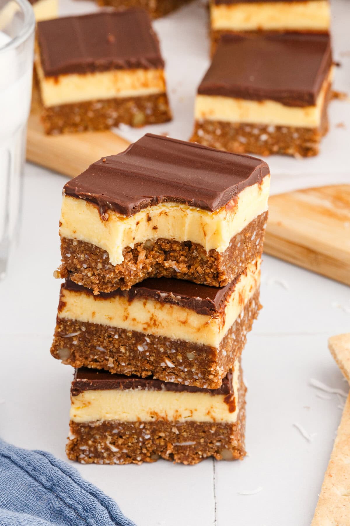stack of Nanaimo Bars with a bite out of it