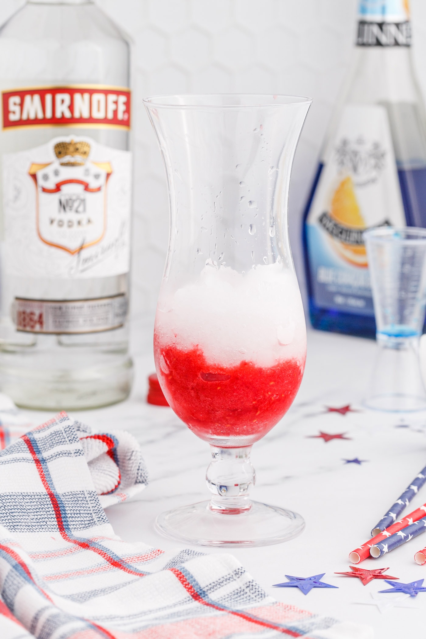 raspberry slush with lemonade slush on top in a glass