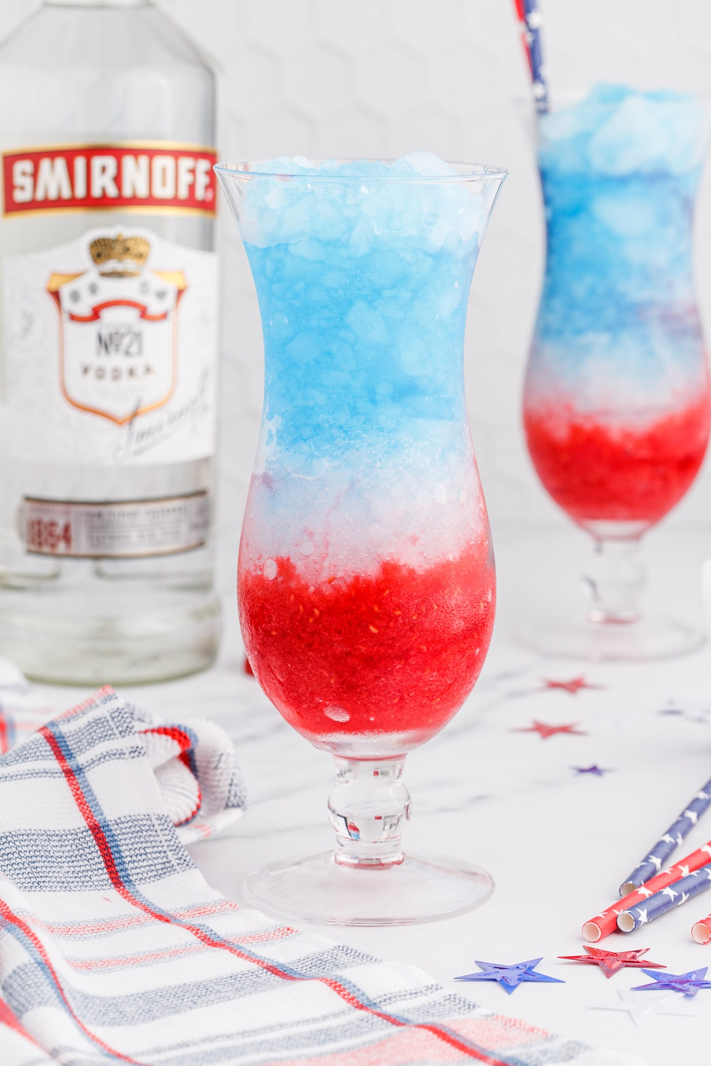layers of raspberry, lemonade, and blue curacao in a drink glass