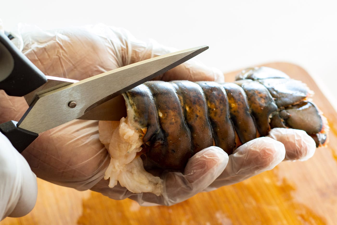 kitchen sheers cutting lobster tail