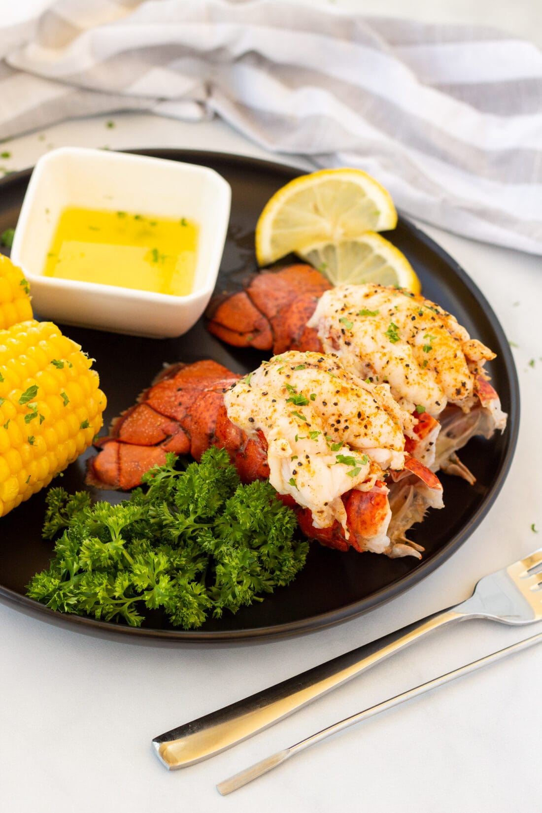 2 Steamed Lobster Tails on a plate