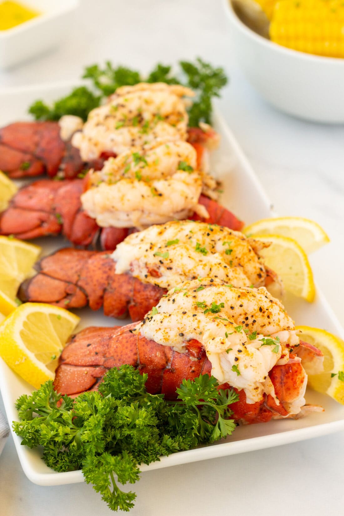 4 Steamed Lobster Tails on a platter