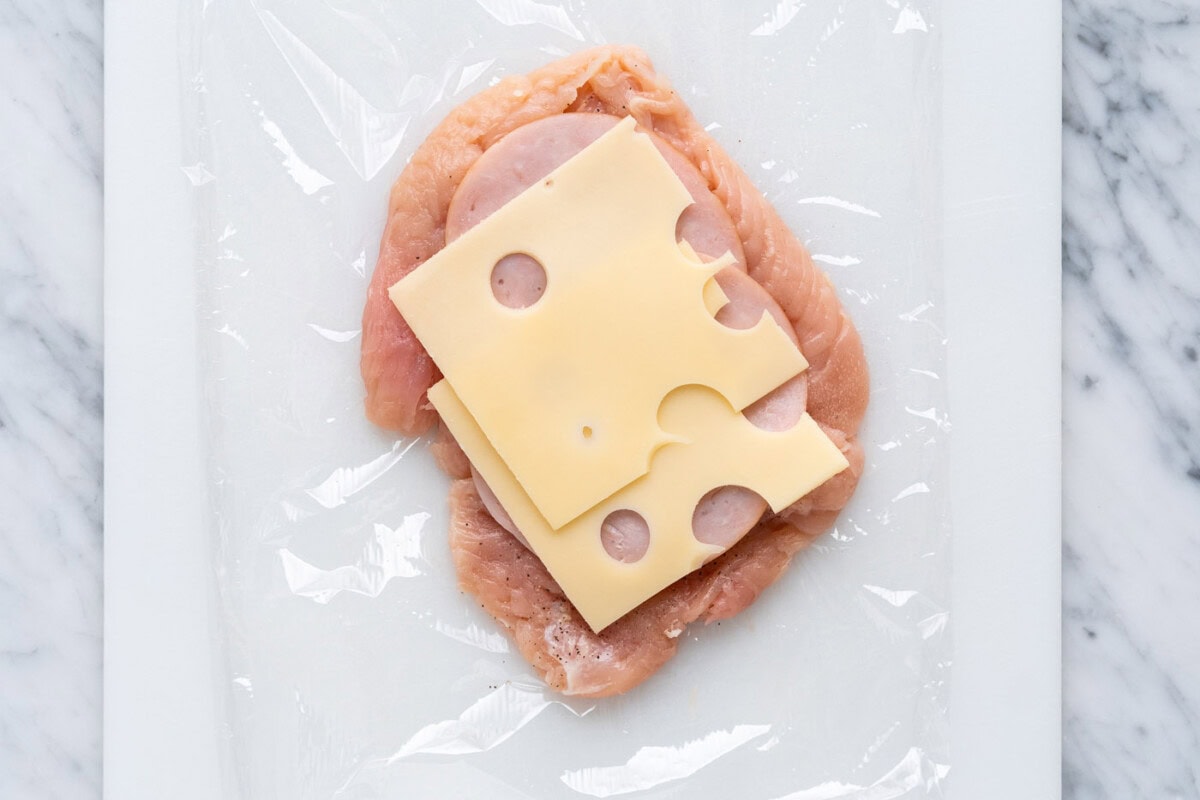 ham and swiss cheese over pounded chicken breast