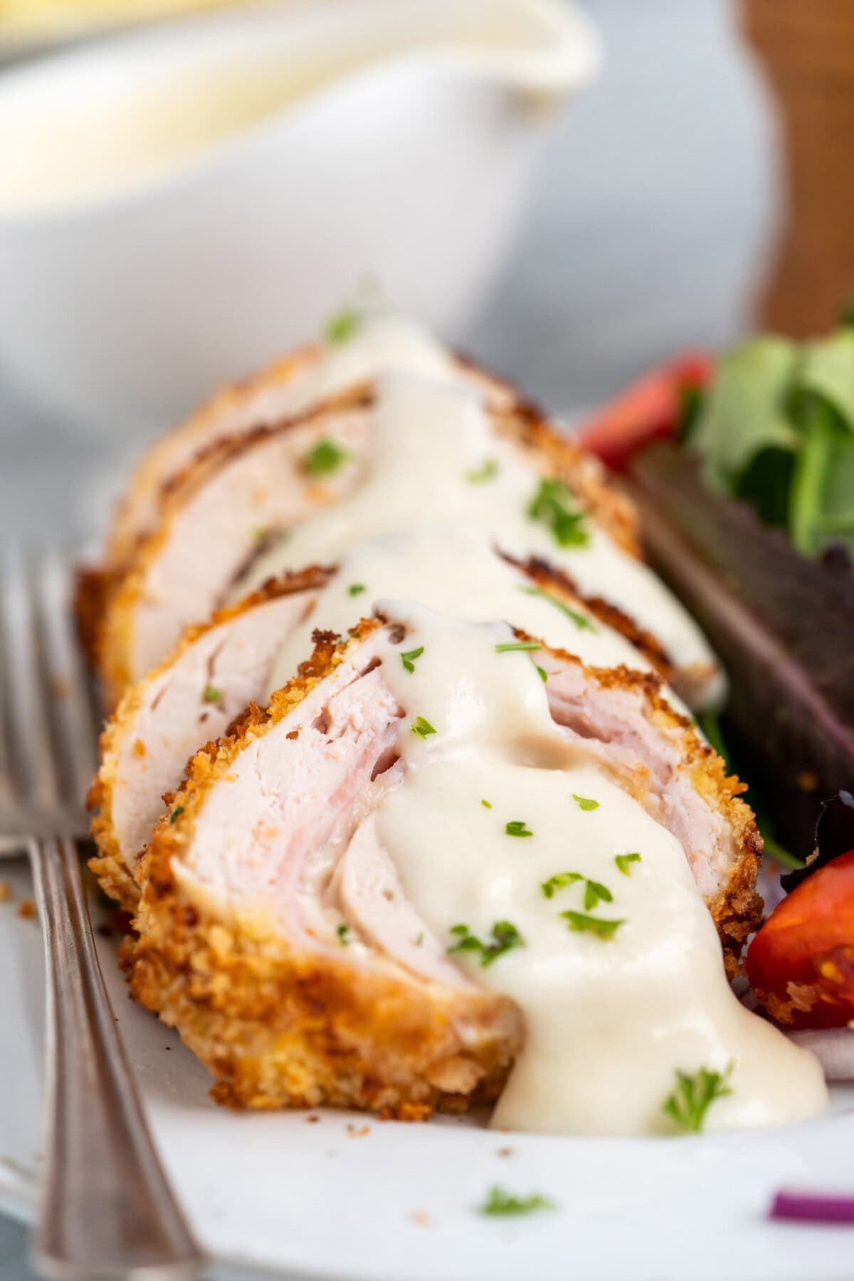 sices of Air Fryer Chicken Cordon Bleu with sauce