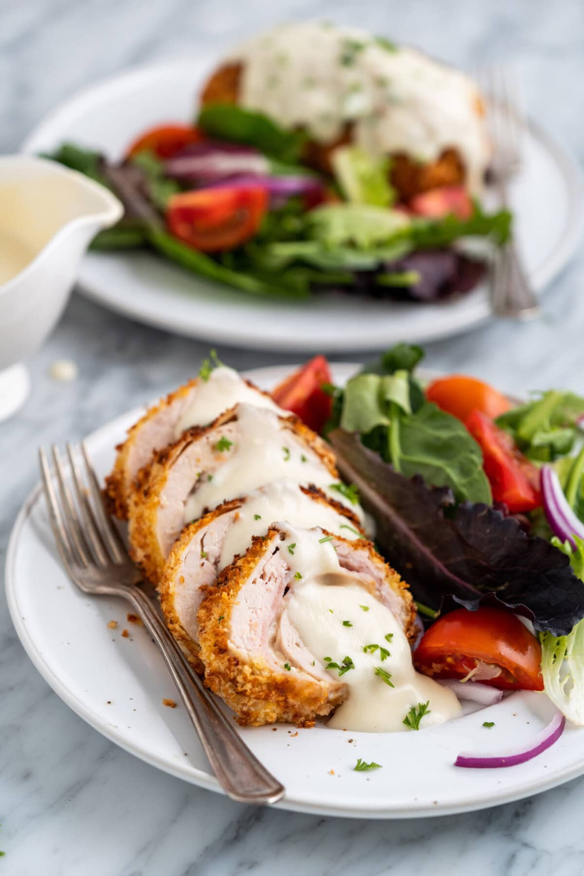 plate of Air Fryer Chicken Cordon Bleu with salad