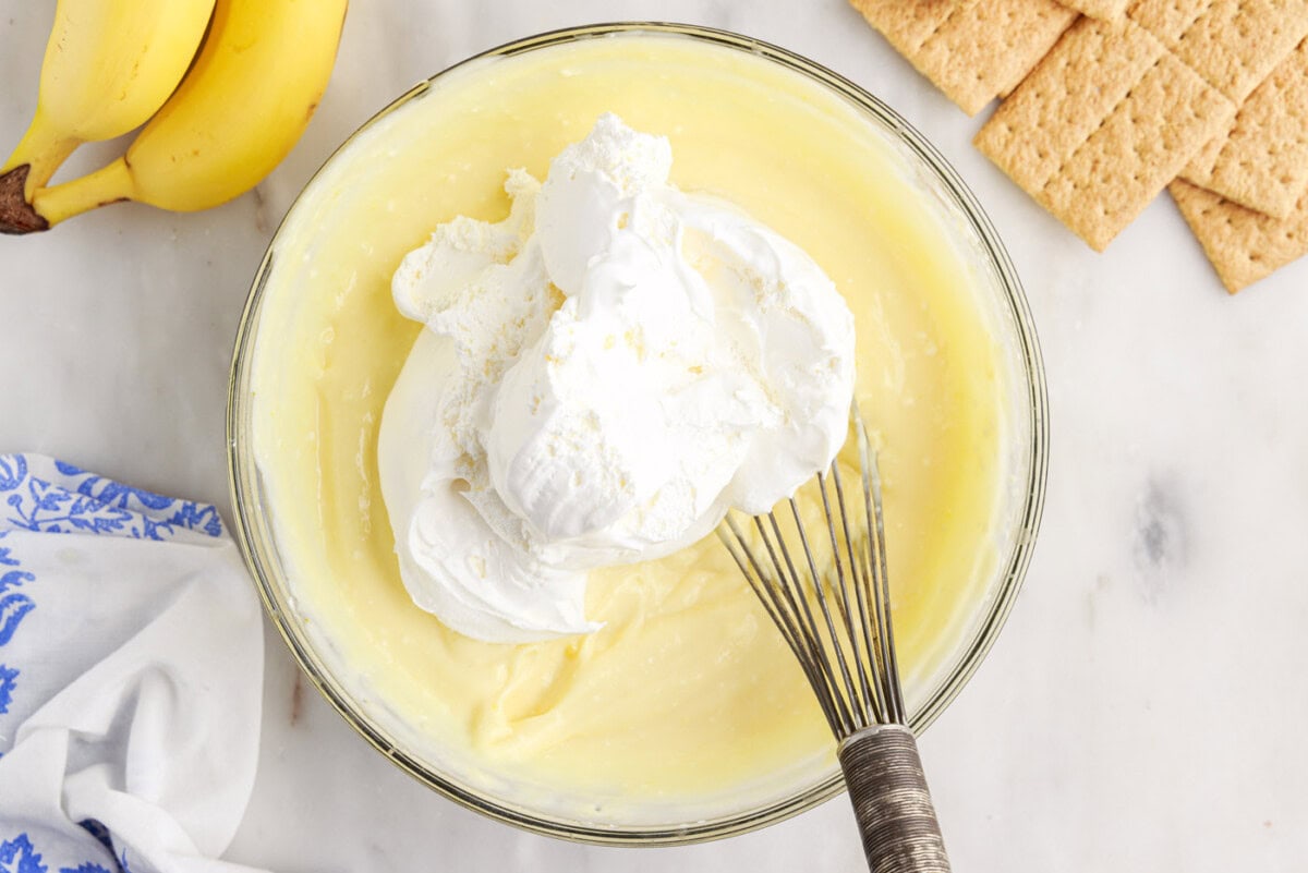 folding cool whip into banana cream pudding mixture