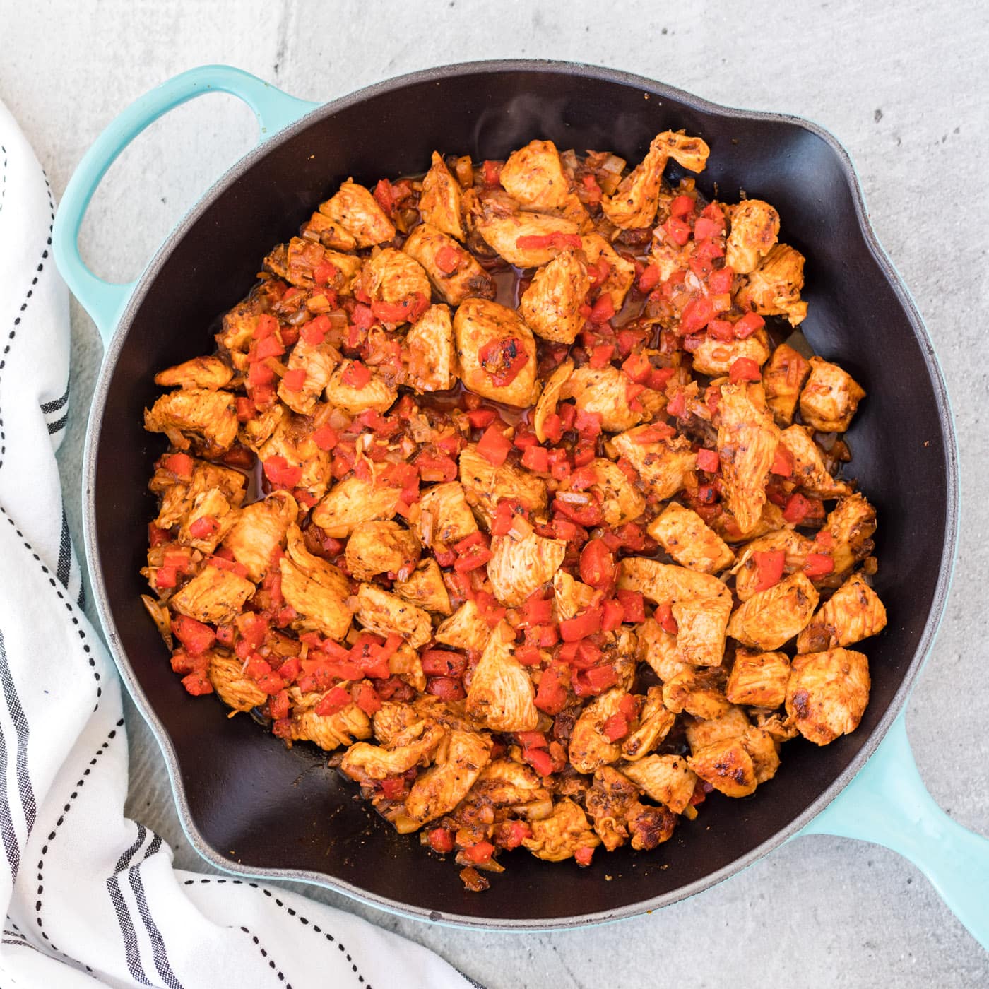 roasted bell pepper in a skillet with cajun chicken