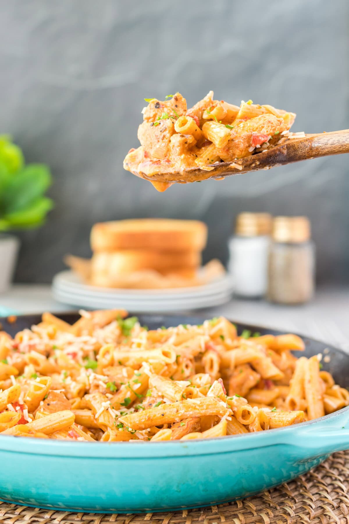 wooden spoon serving some Cajun Chicken Pasta