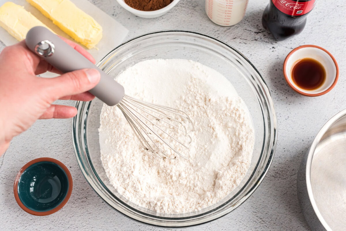 dry ingredients for cake whisked in a bowl