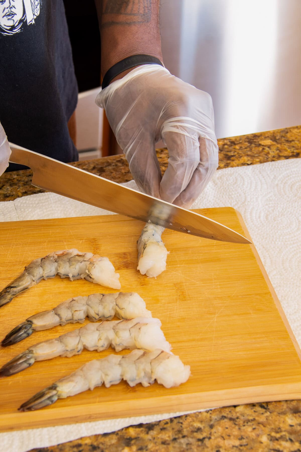 scoring shrimp with a knife