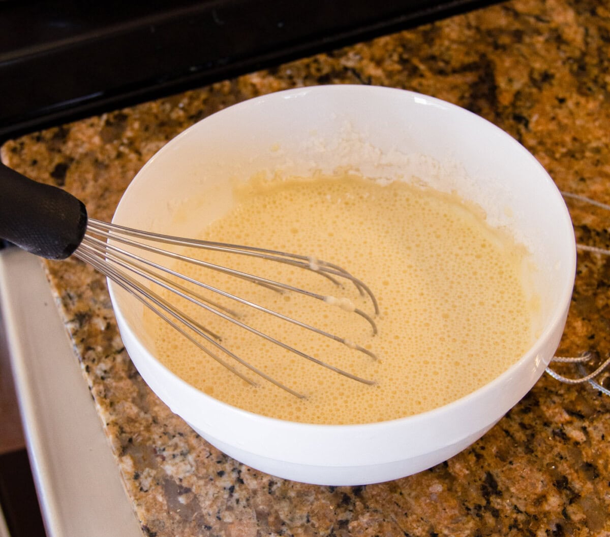 egg, flour, and water whisked in a bowl