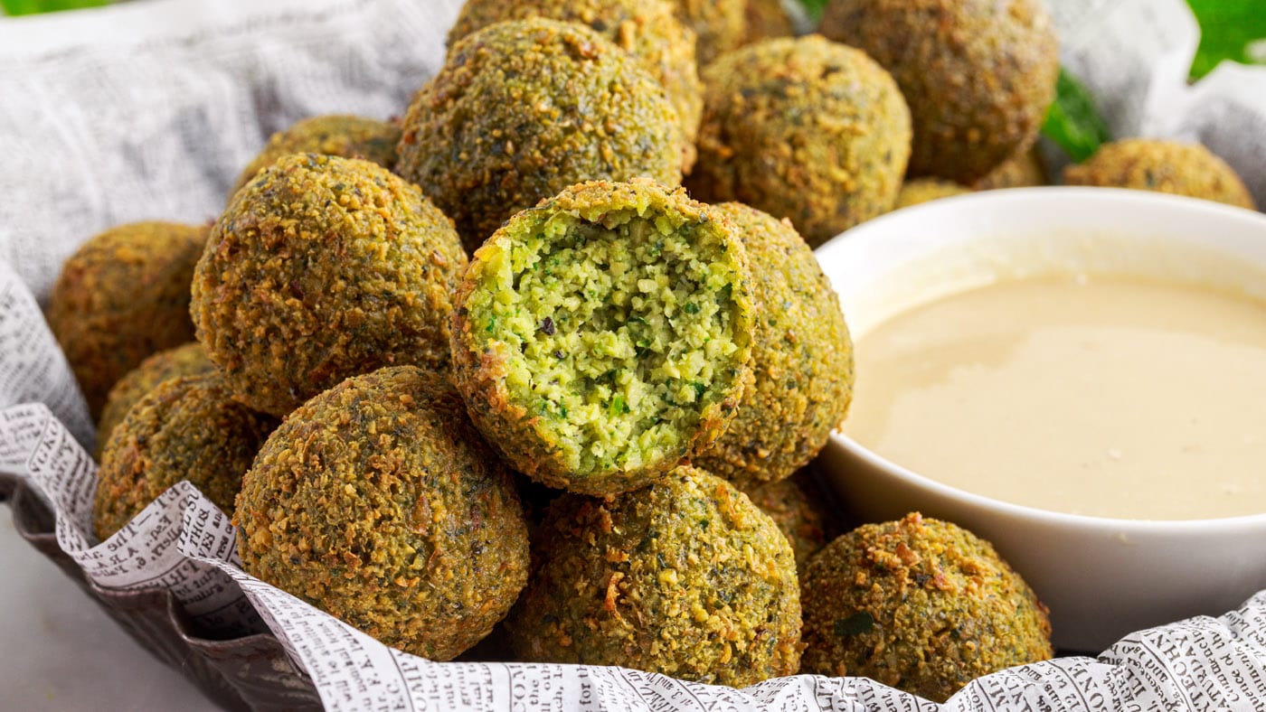 Falafel is made with chickpeas and sometimes fava beans that are loaded with flavorful fresh herbs a