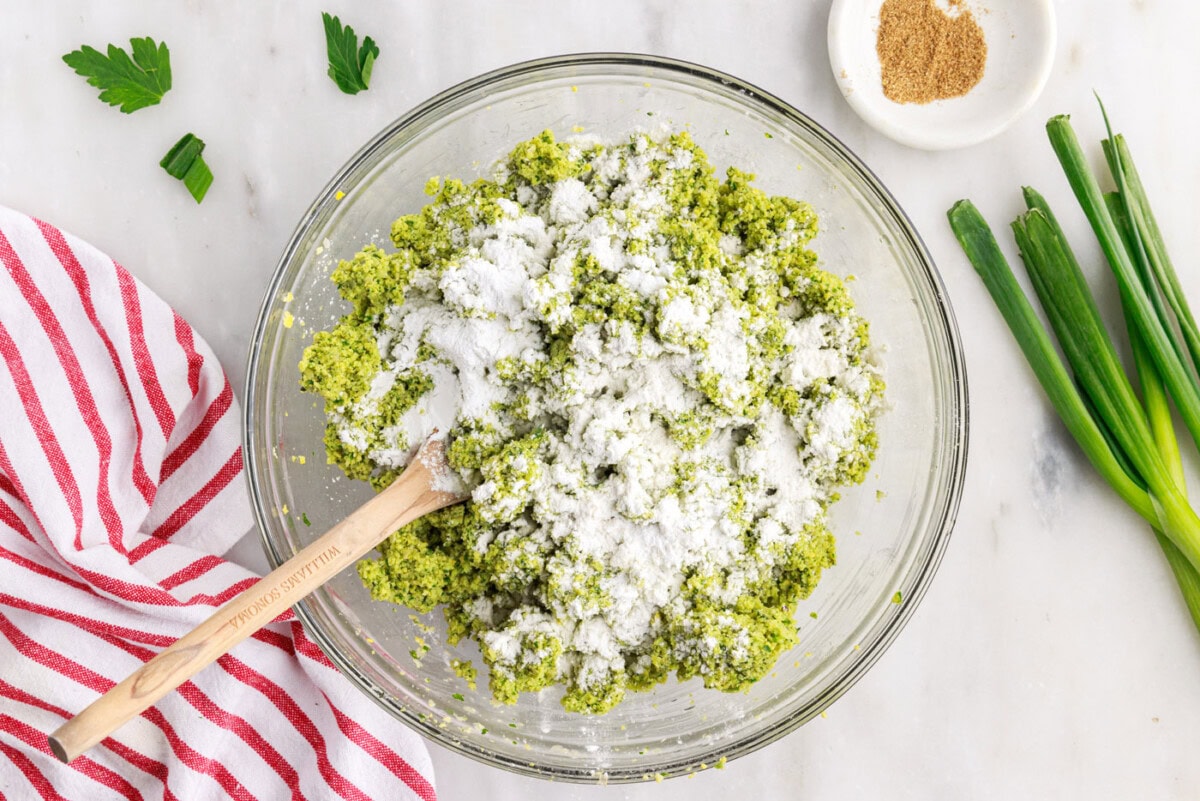 flour and baking powder sprinkled over falafel mixture