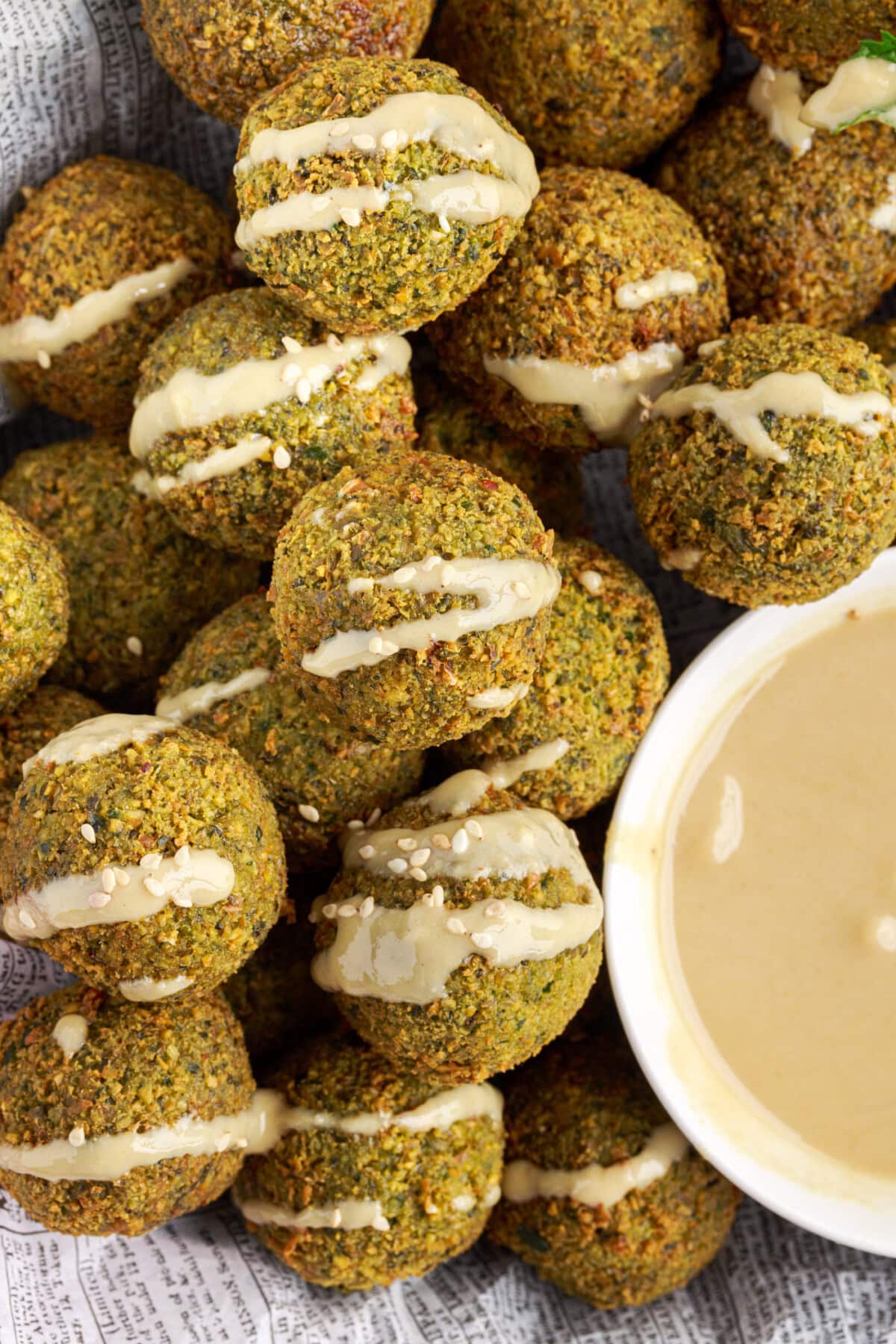 Falafel with sauce drizzled on top