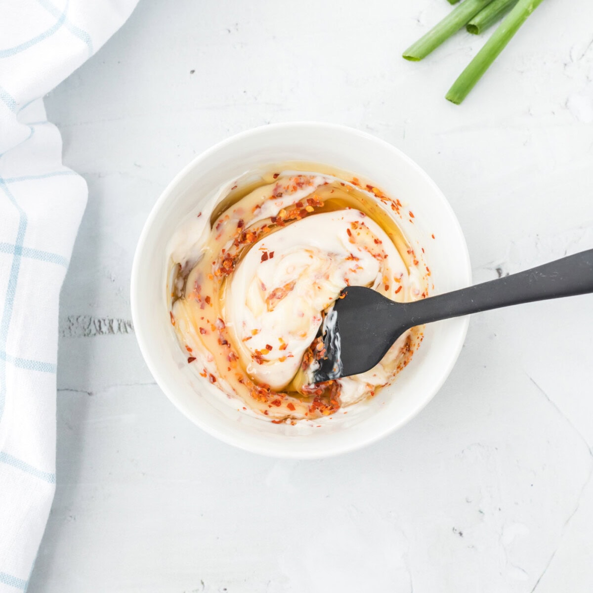 spatula stirring honey walnut shrimp sauce