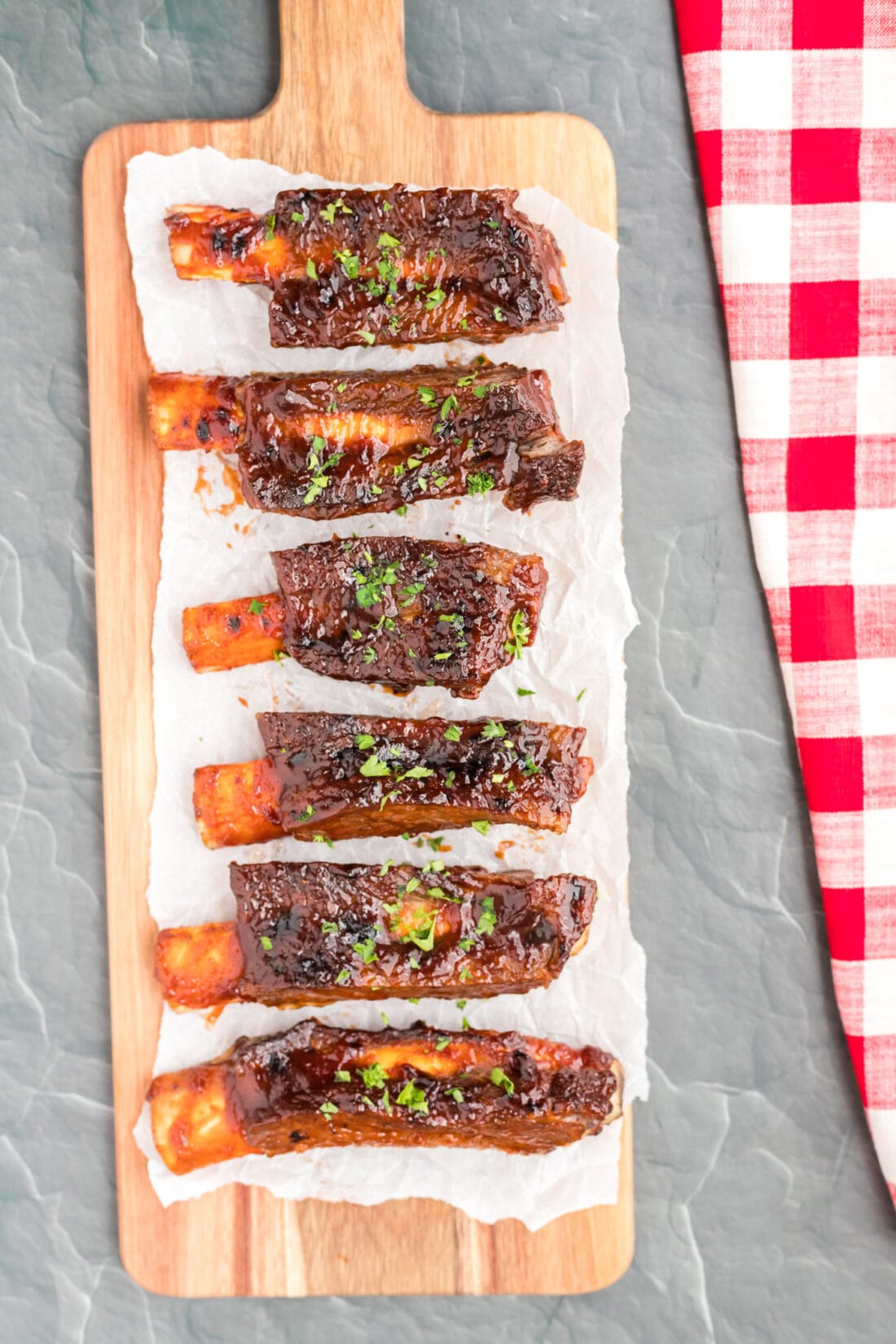 Instant Pot Beef Ribs on a long cutting board