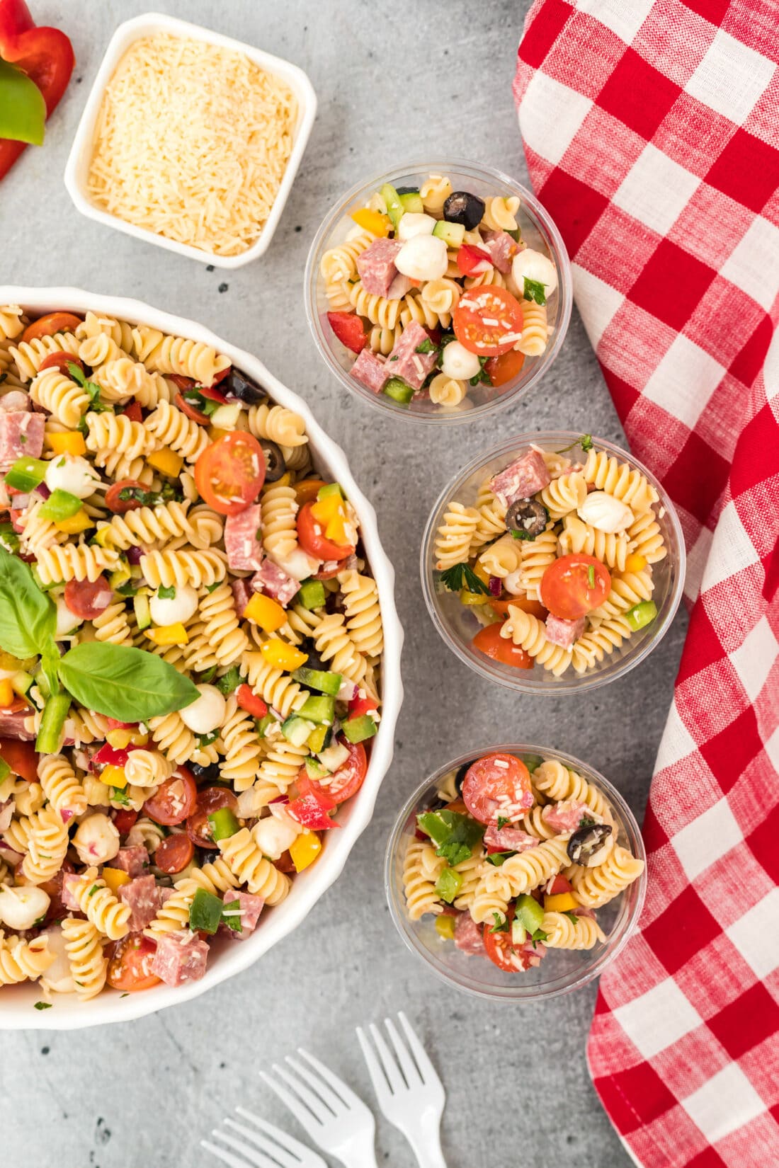 bowl of Italian Pasta Salad with three servings in small cups
