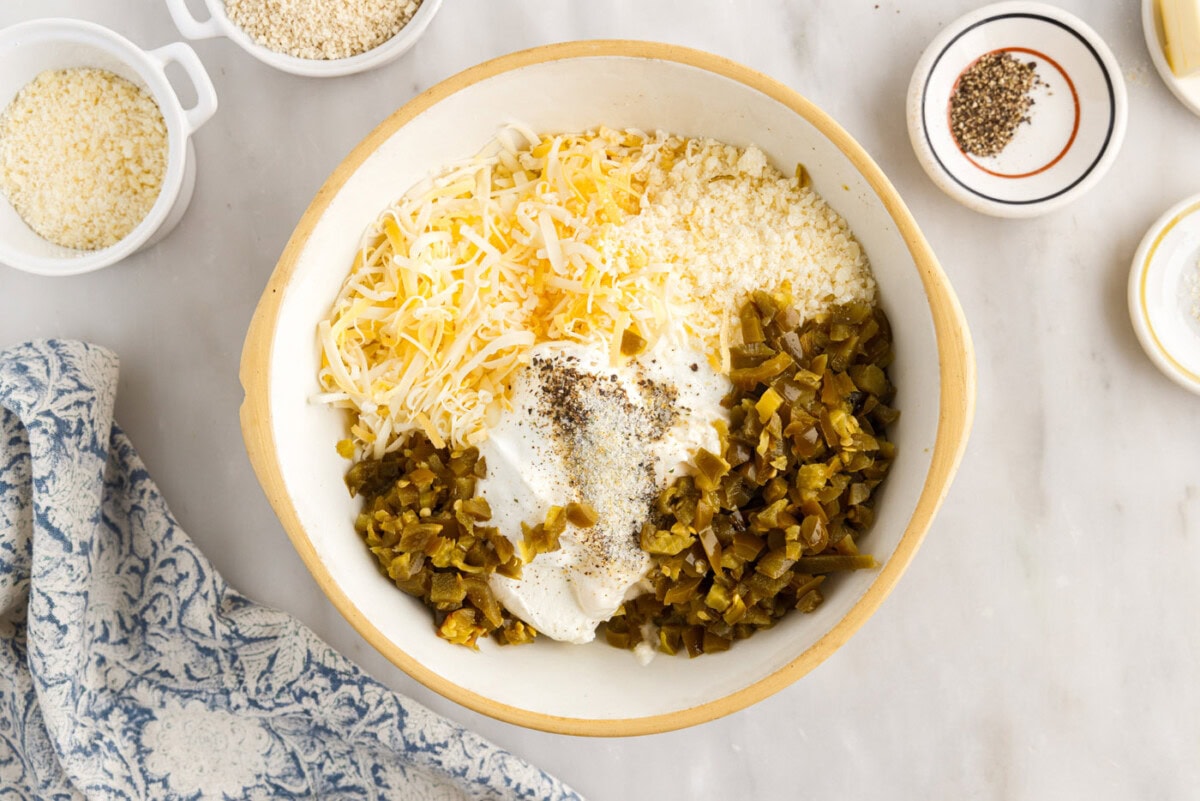 ingredients for jalapeno popper dip in a mixing bowl