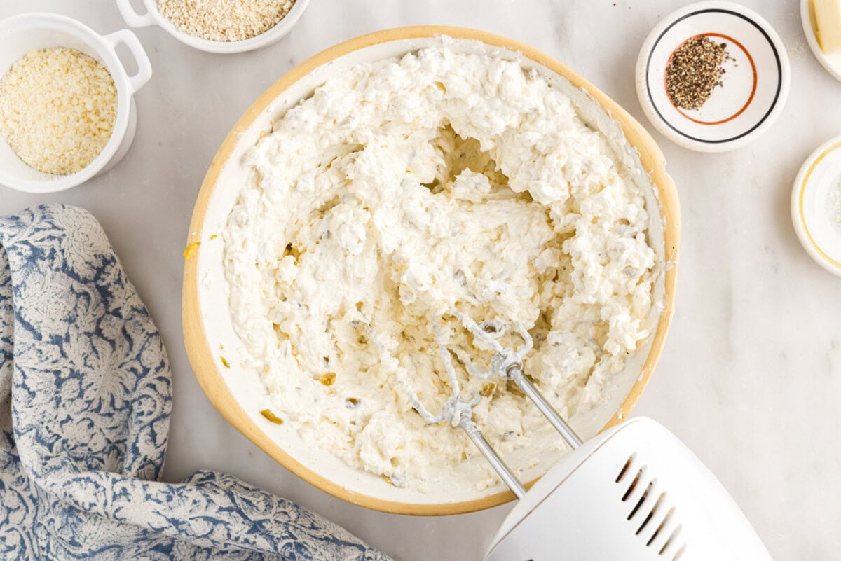 hand mixer mixing jalapeno popper dip
