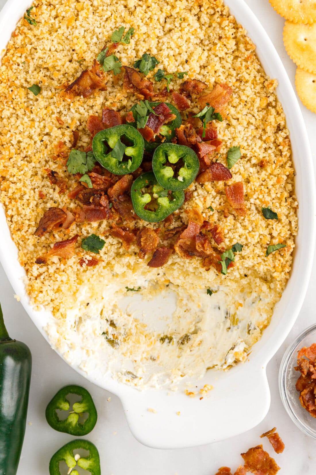 Jalapeno Popper Dip in a dish with some removed