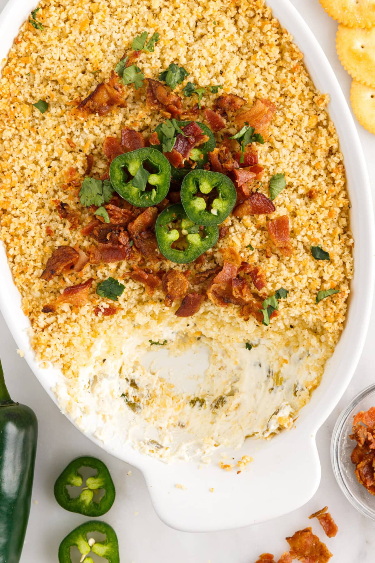 Jalapeno Popper Dip in a dish with some removed