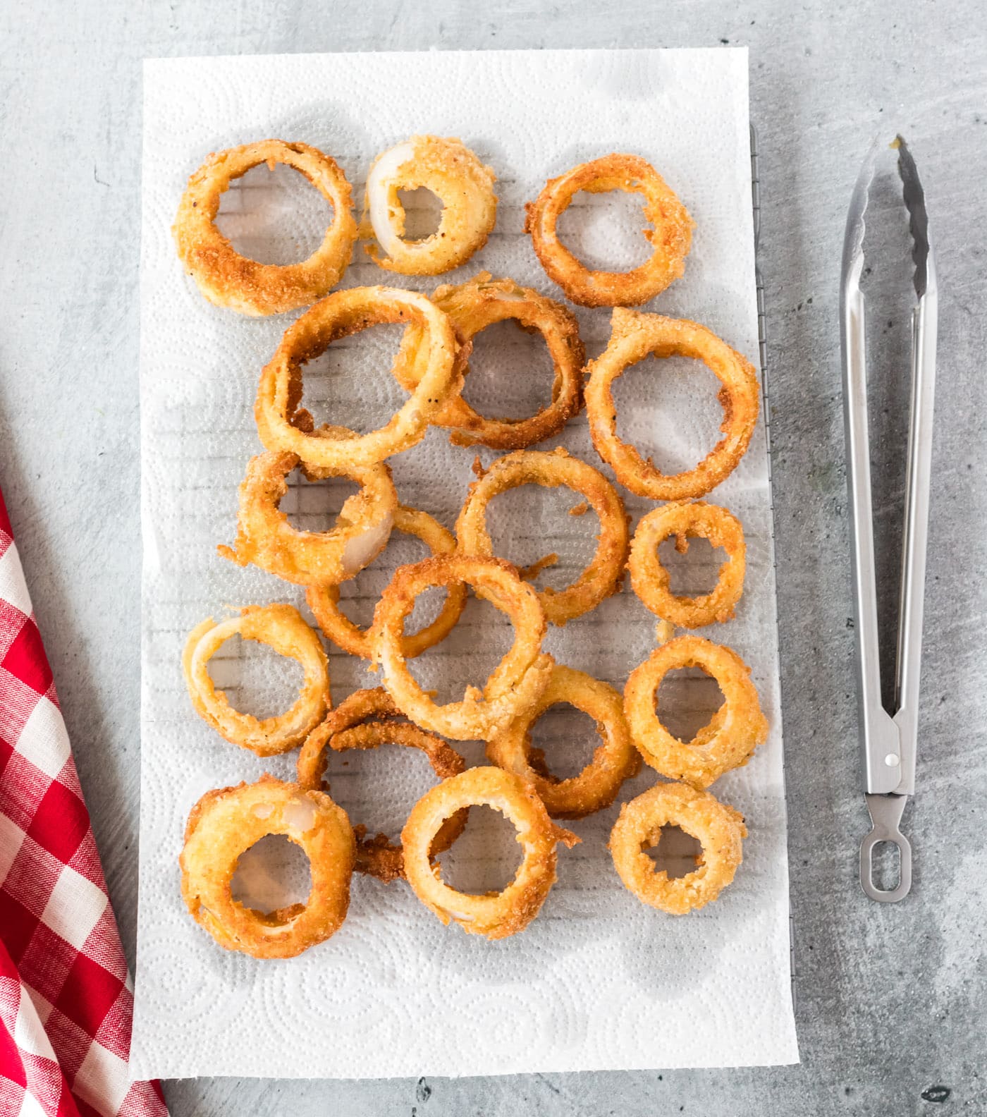 fried onion rings on a paper towel