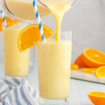 pouring an Orange Julius from a blender