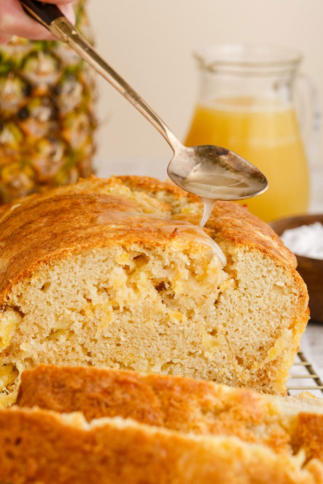 drizzling sauce on Pineapple Quick Bread