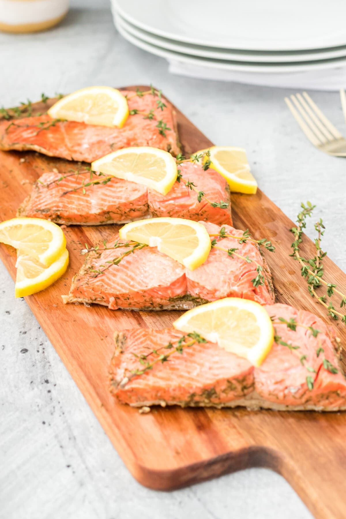 4 filets of Poached Salmon on wooden board