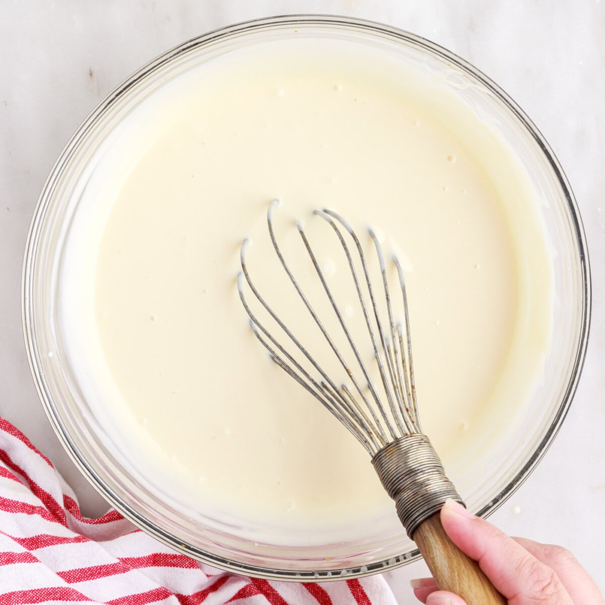 ingredients for rolled ice cream whisked in a bowl