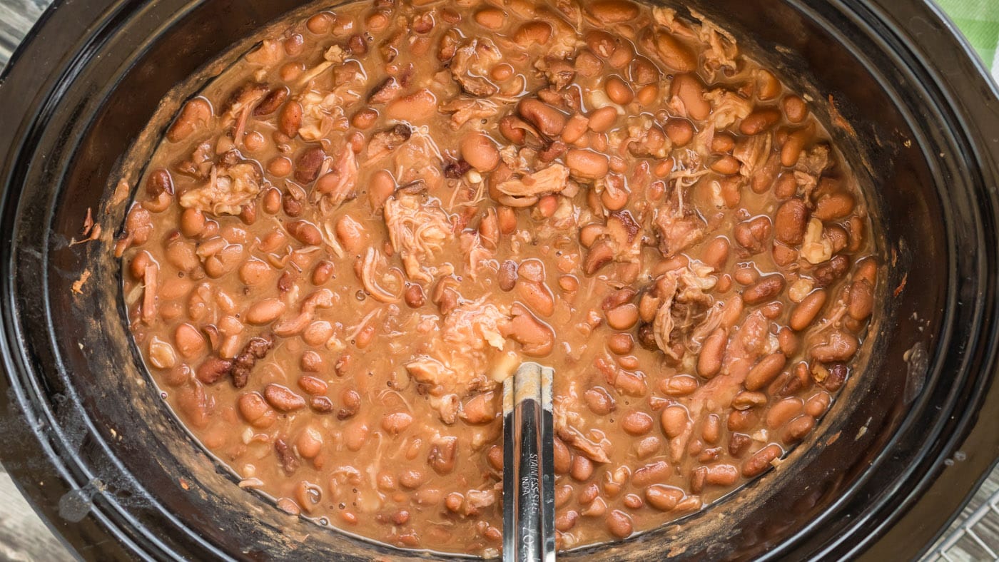 These hearty and tender crockpot pinto beans are cooked low and slow with liquid smoke, turkey tails