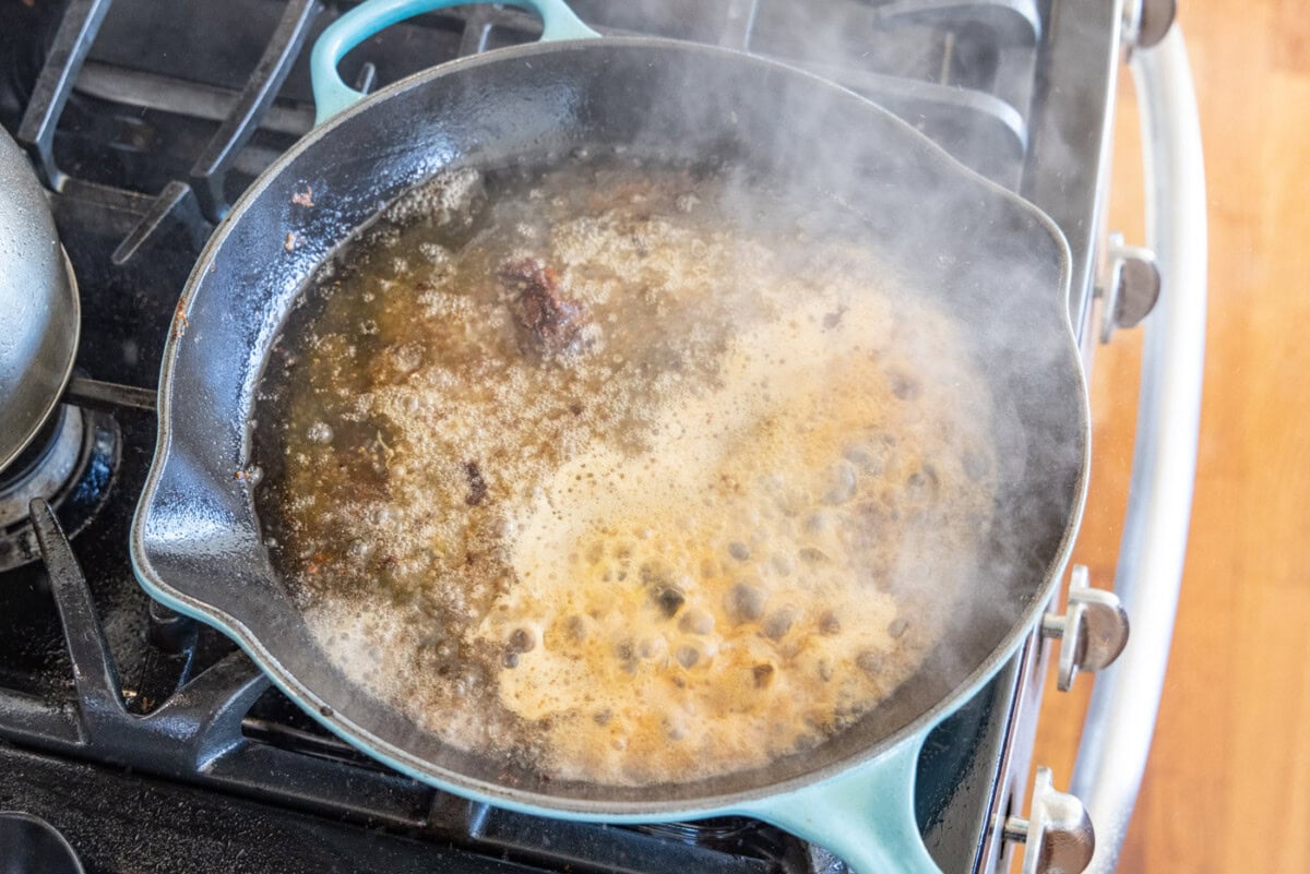 veal piccata sauce in a skillet
